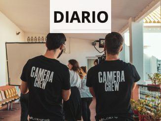 man in black and white crew neck t-shirt standing beside man in black crew neck