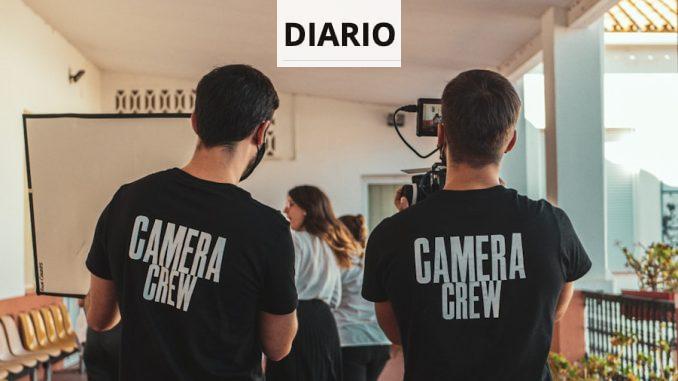 man in black and white crew neck t-shirt standing beside man in black crew neck