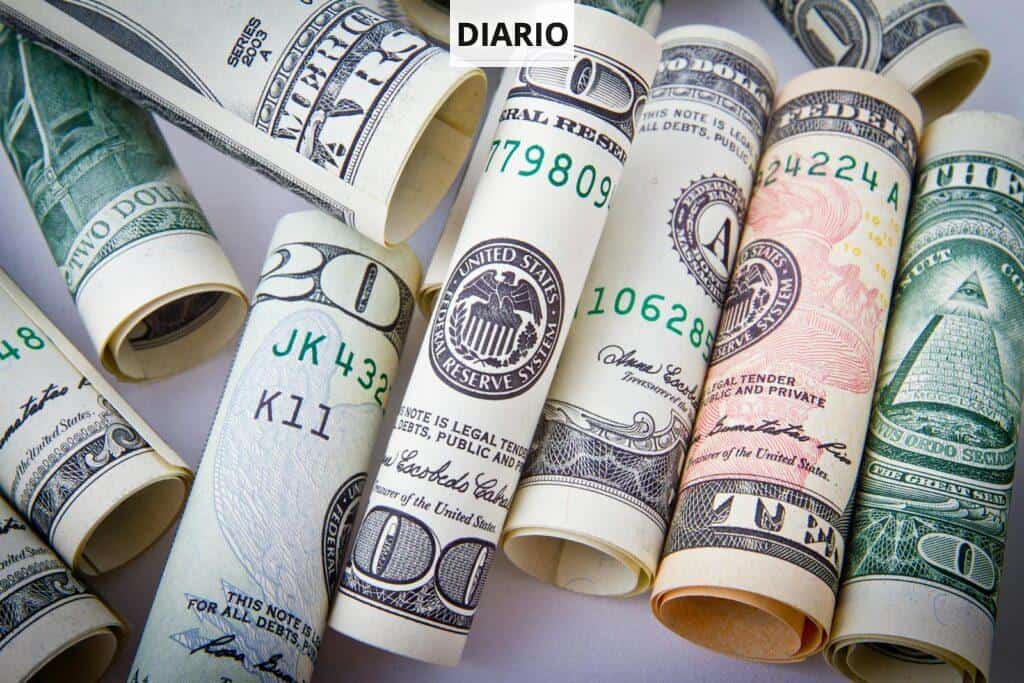 Close-up of rolled US dollar bills symbolizing wealth, financial success, and currency.